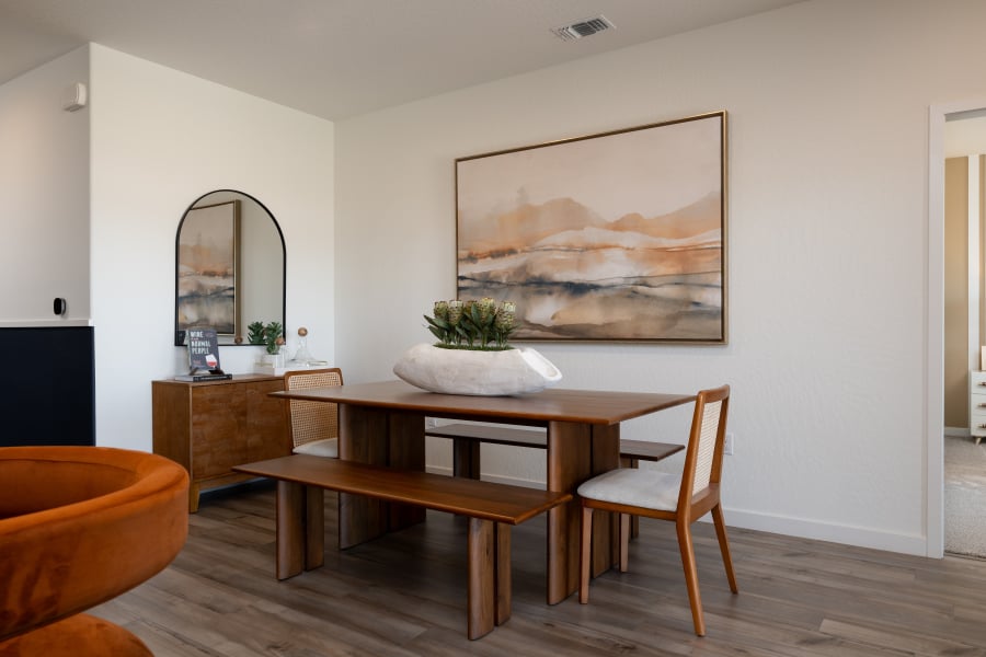 A room with a table and chairs.