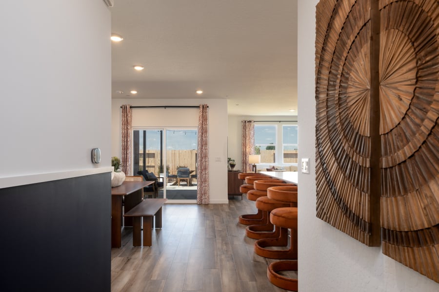 A room with a desk and chairs.