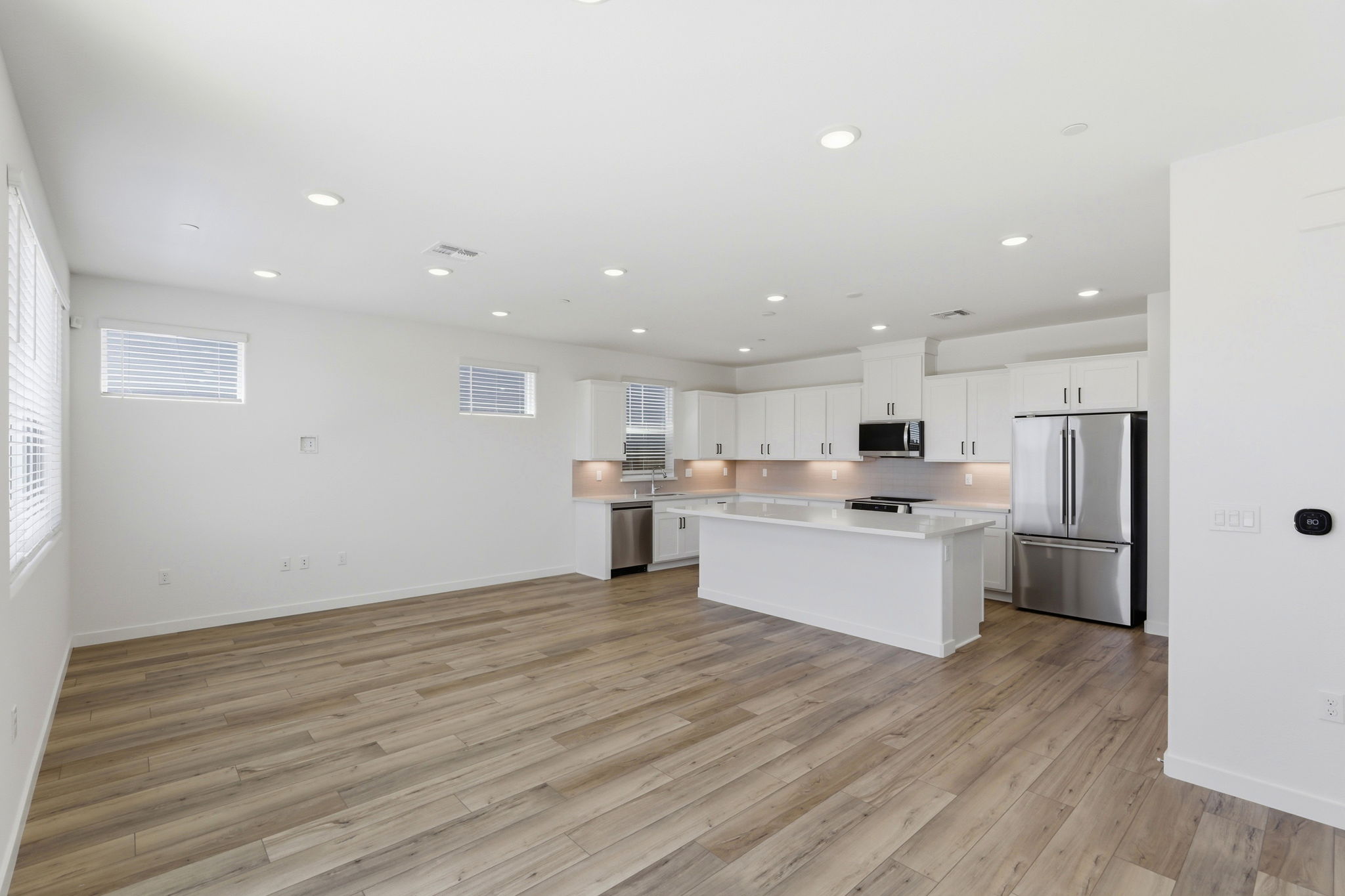 A large kitchen with white cabinets.