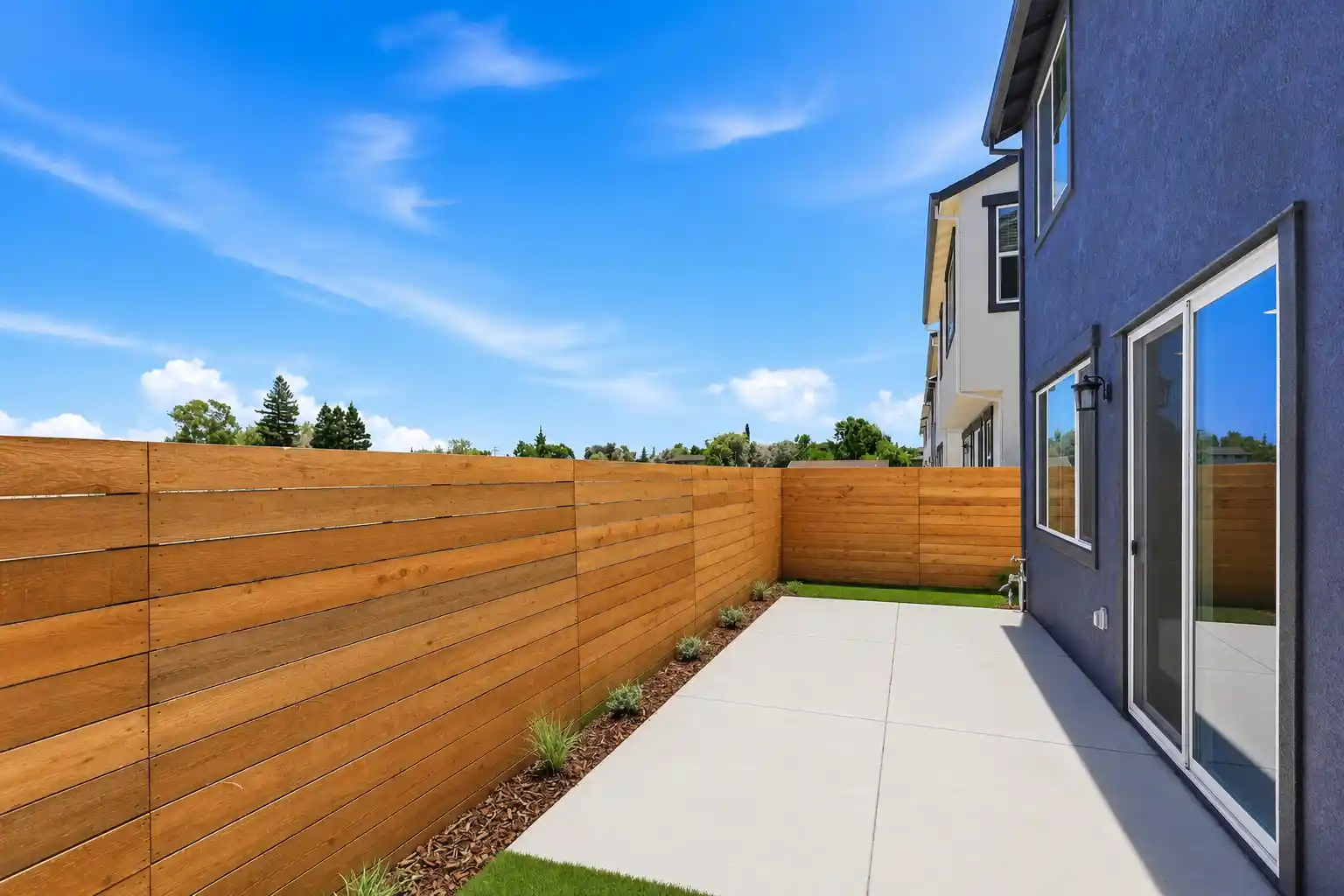 A wooden fence and a house.