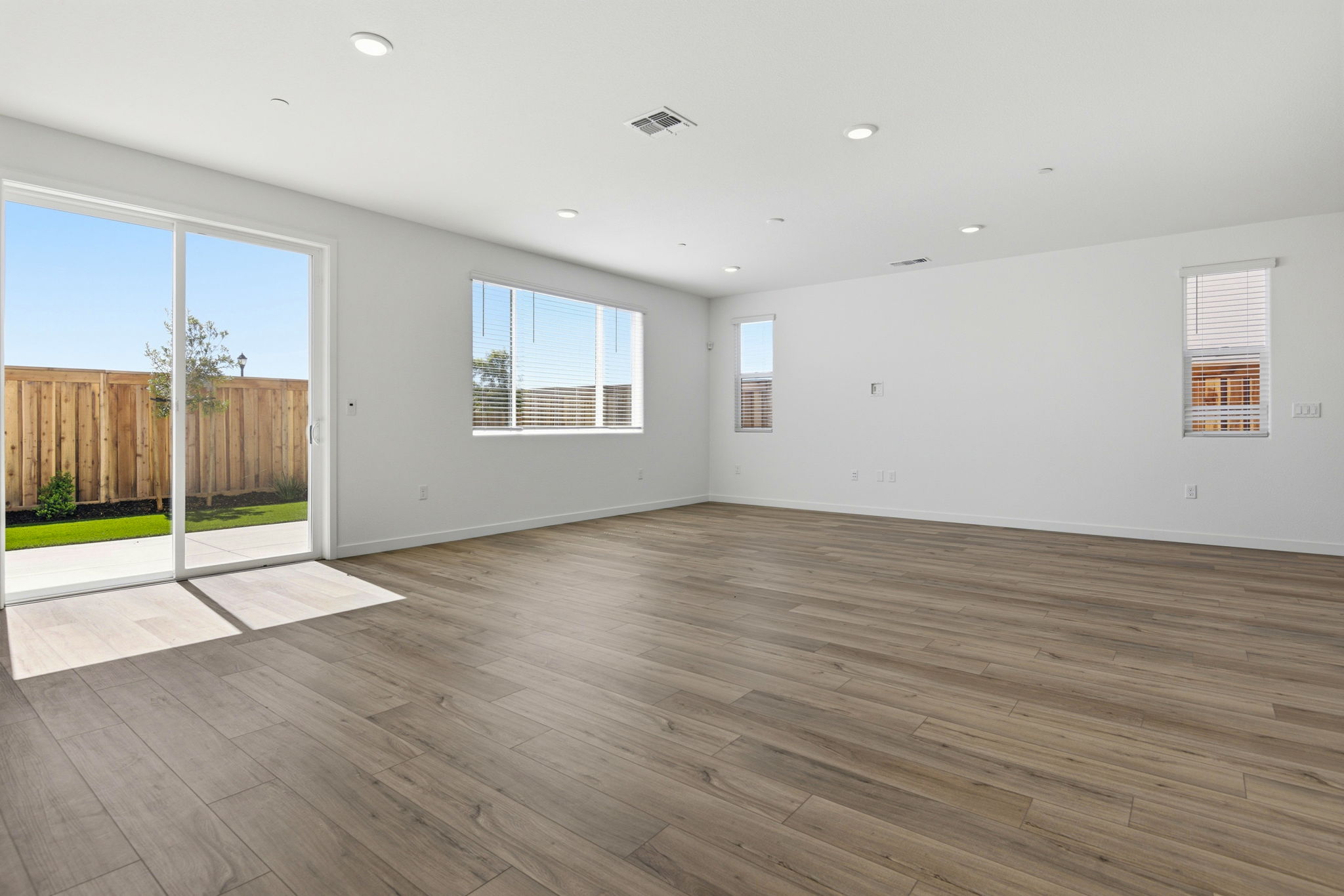 A room with a wood floor and a wood floor.