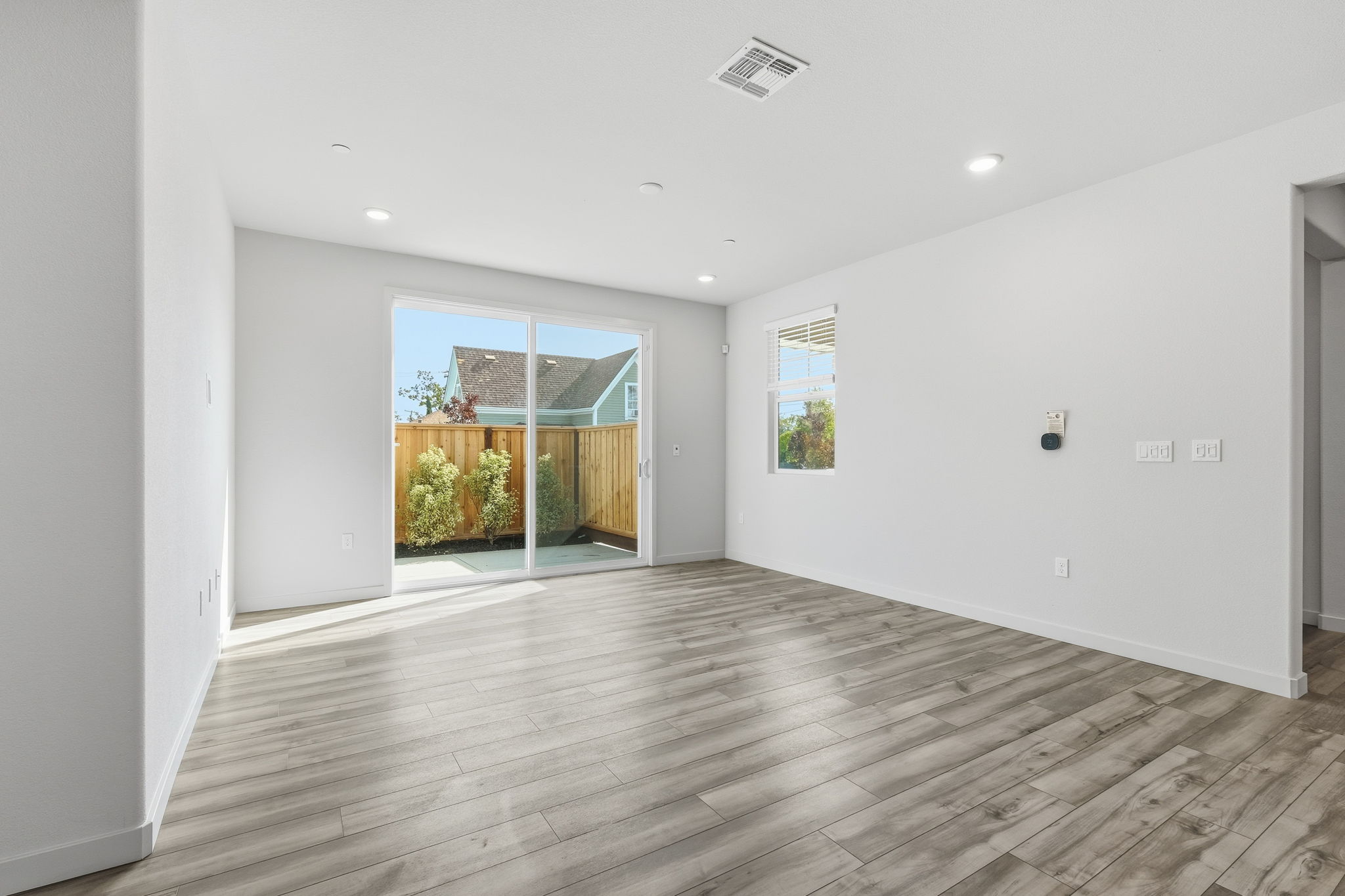 A room with a wood floor and a wood floor.