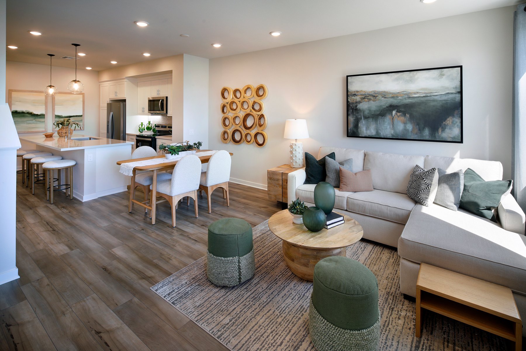 A living room with a large dining table and couches.