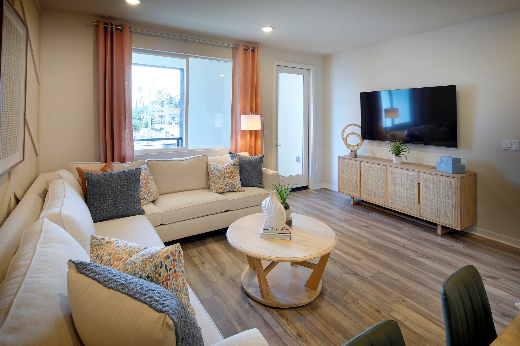 A living room with a tv and couches.