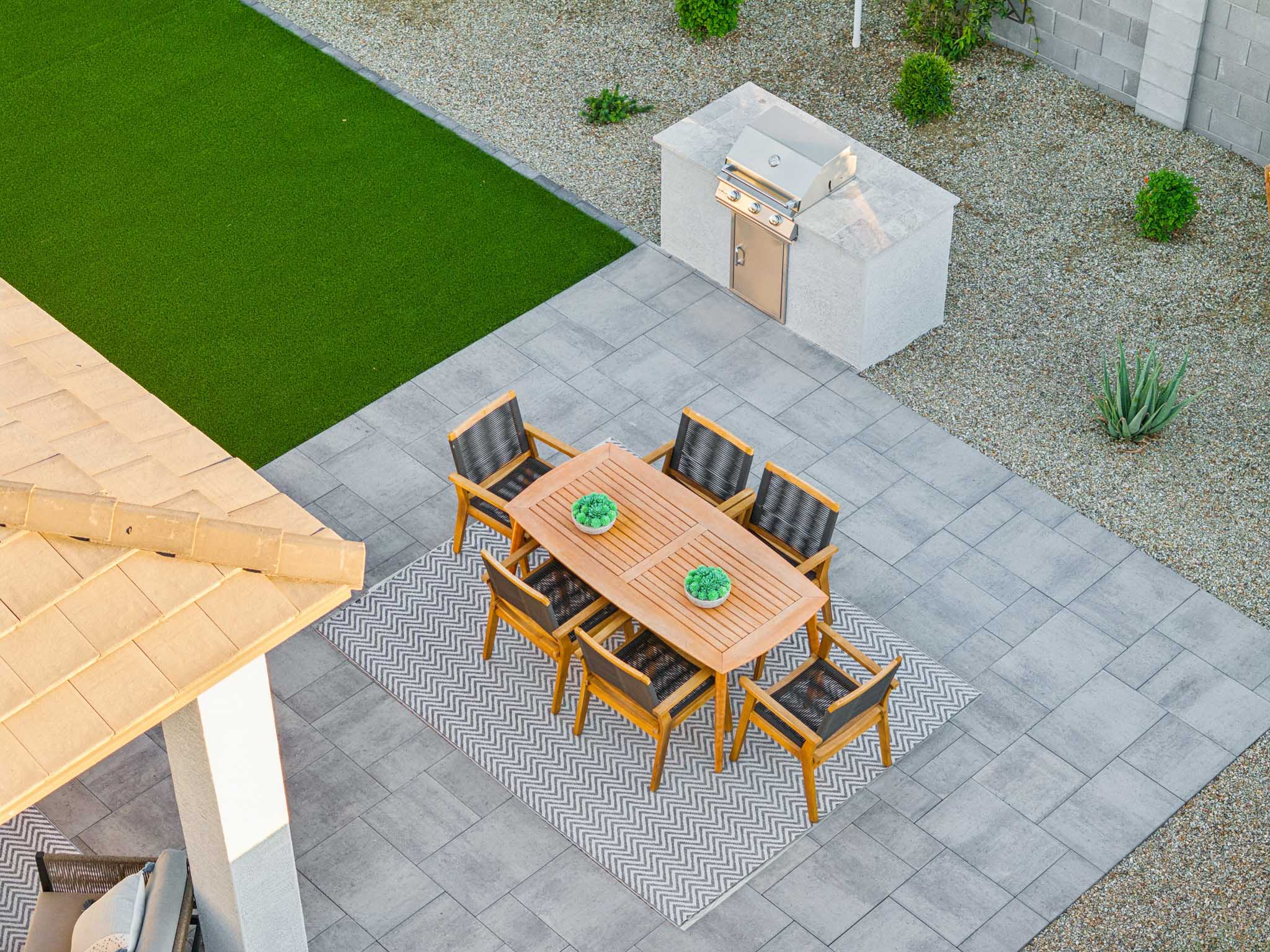 A table and chairs on a patio.