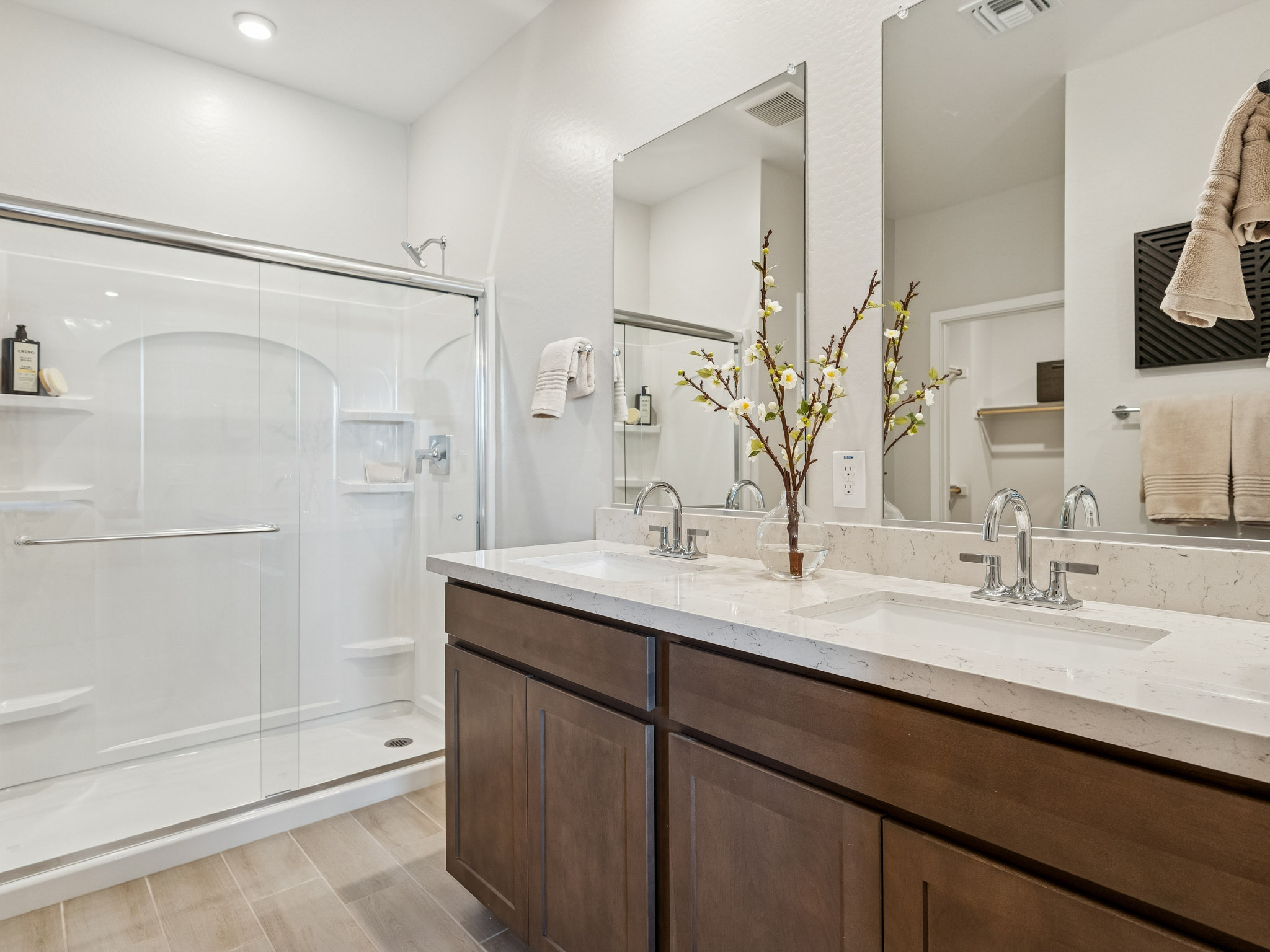 A bathroom with a large mirror.