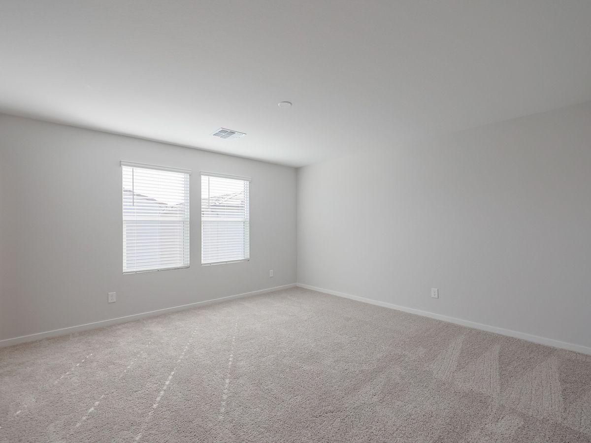 A room with a couple of windows.