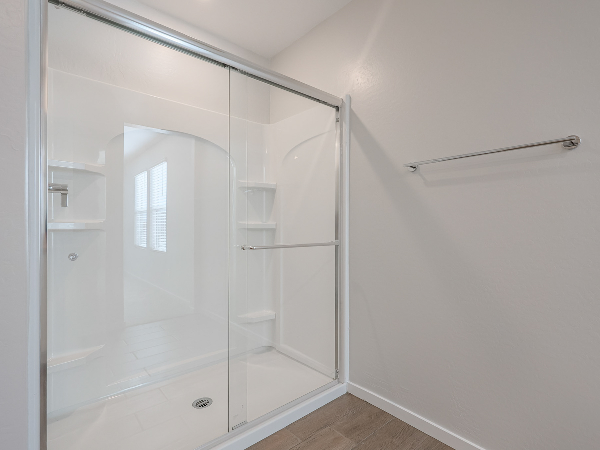 A shower unit in a bathroom.