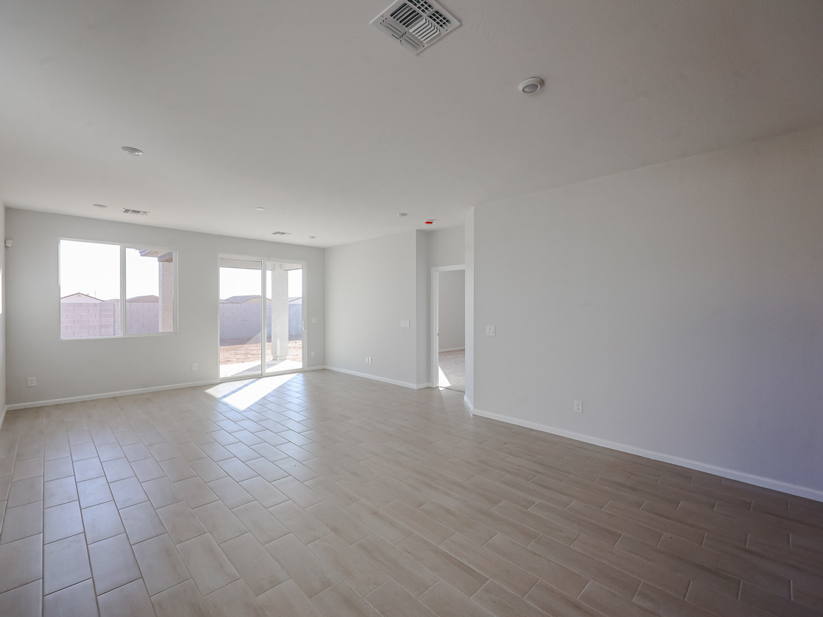 A room with a tile floor and windows.