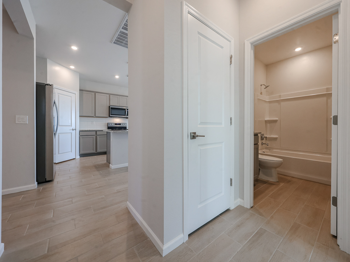 A bathroom with a toilet and a sink.