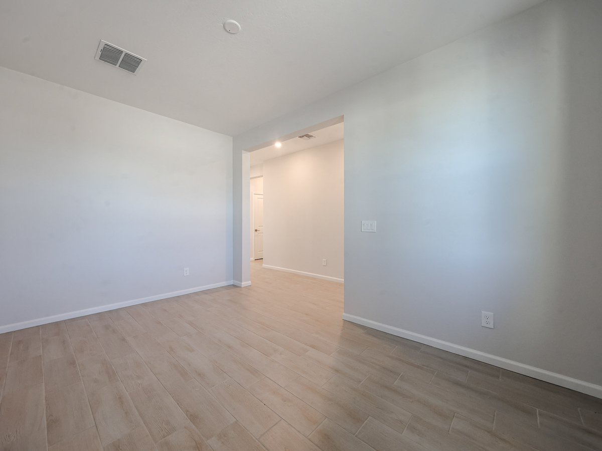A room with a wood floor and a wood floor.