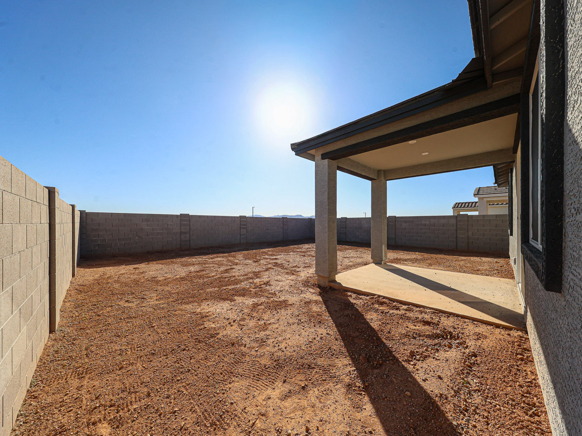 A building with a dirt path.
