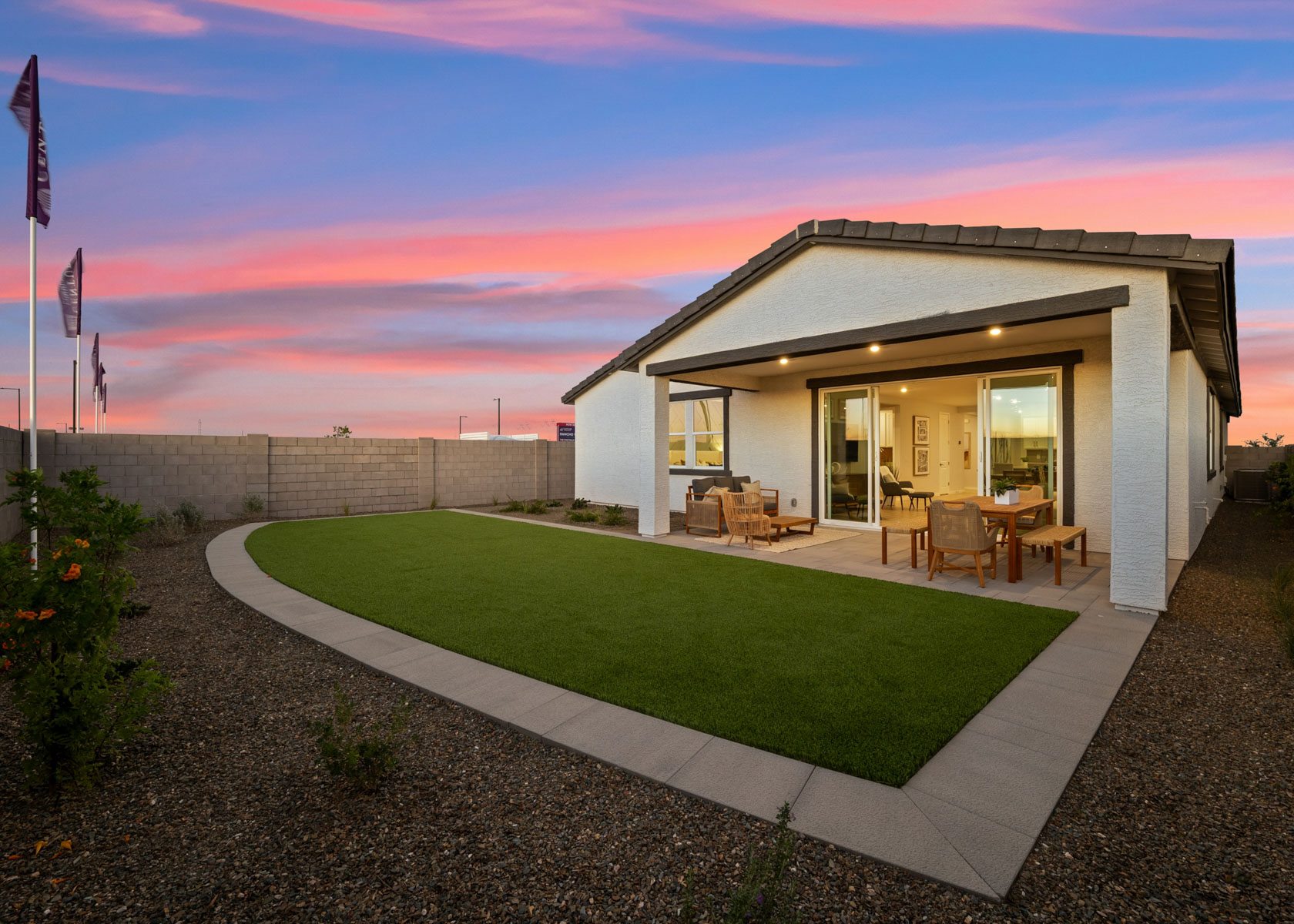 A house with a pool and a lawn.