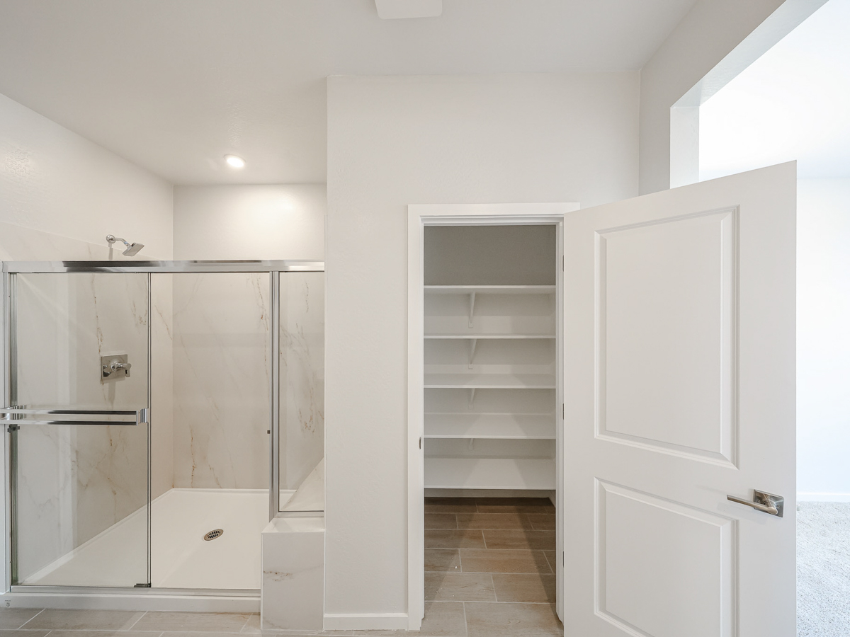 A bathroom with a glass shower.
