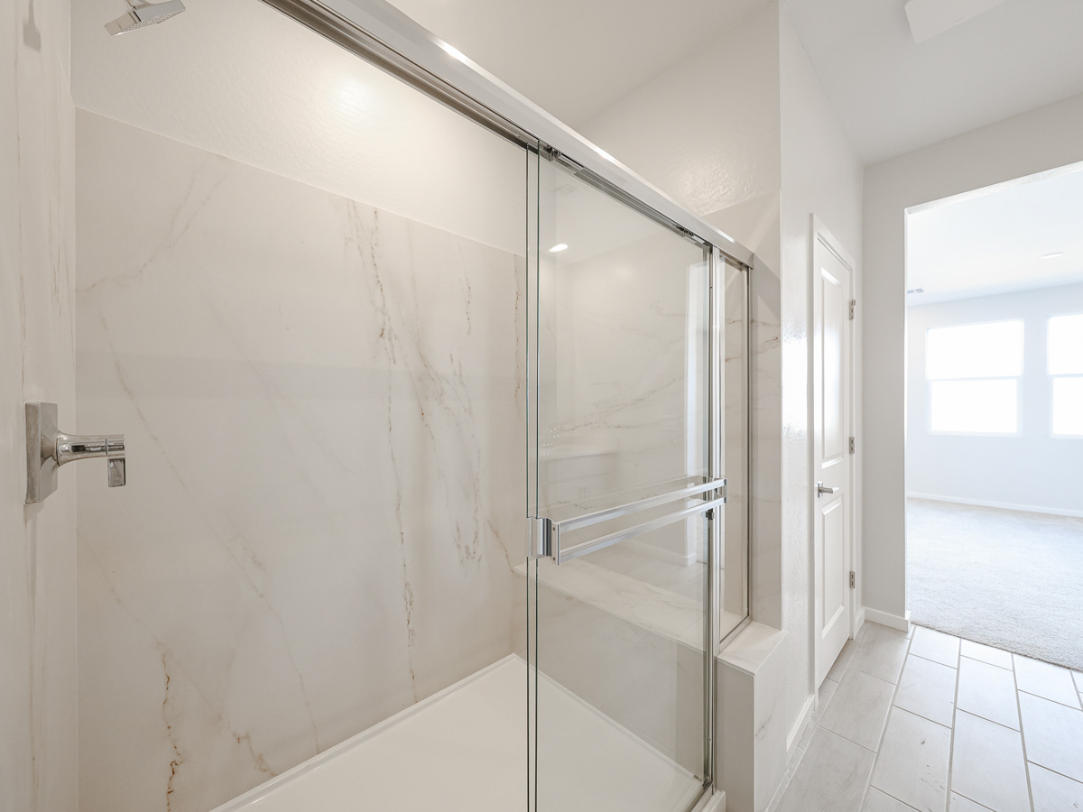 A shower with a glass door.