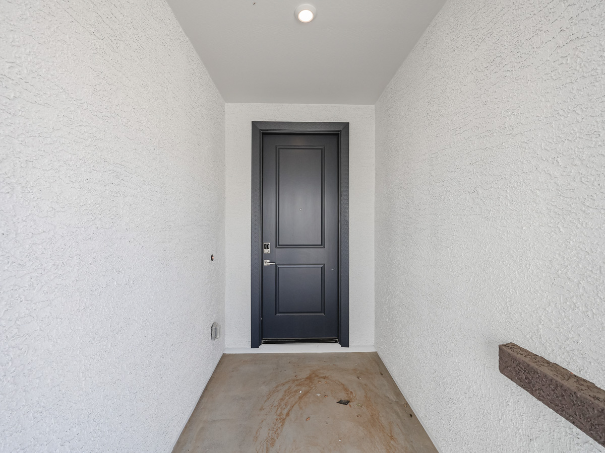 A room with a black door.