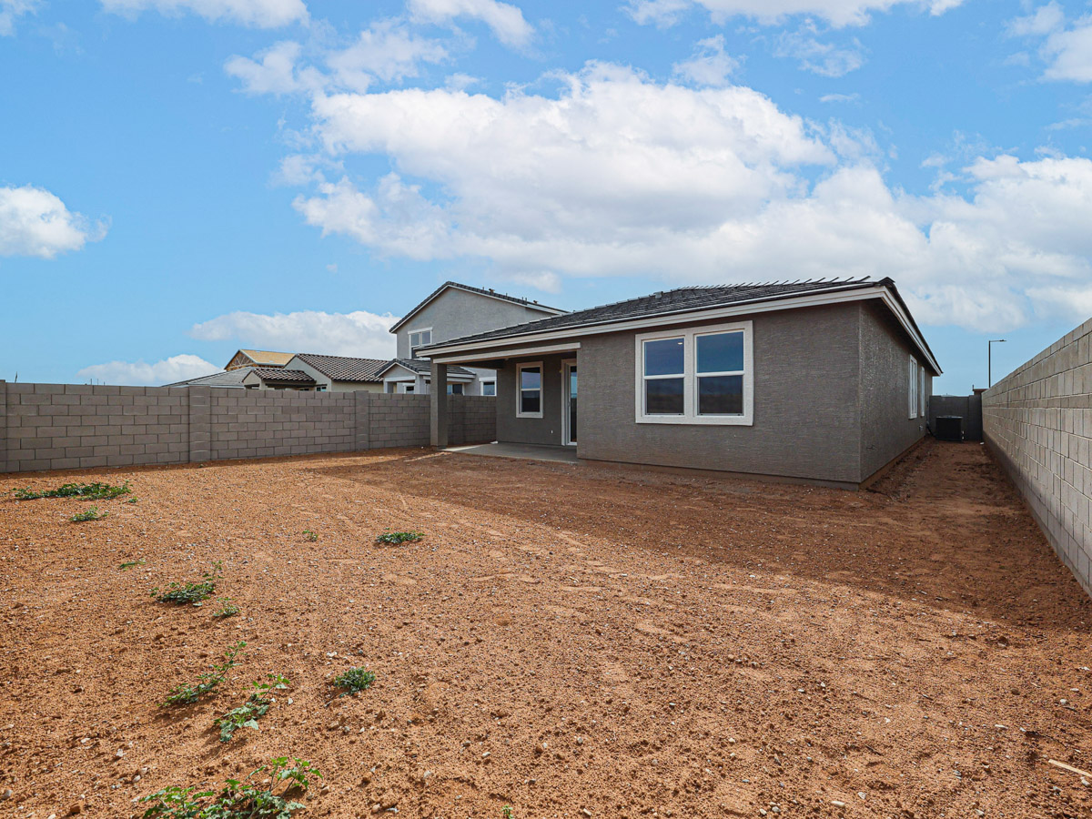 A house with a dirt yard.