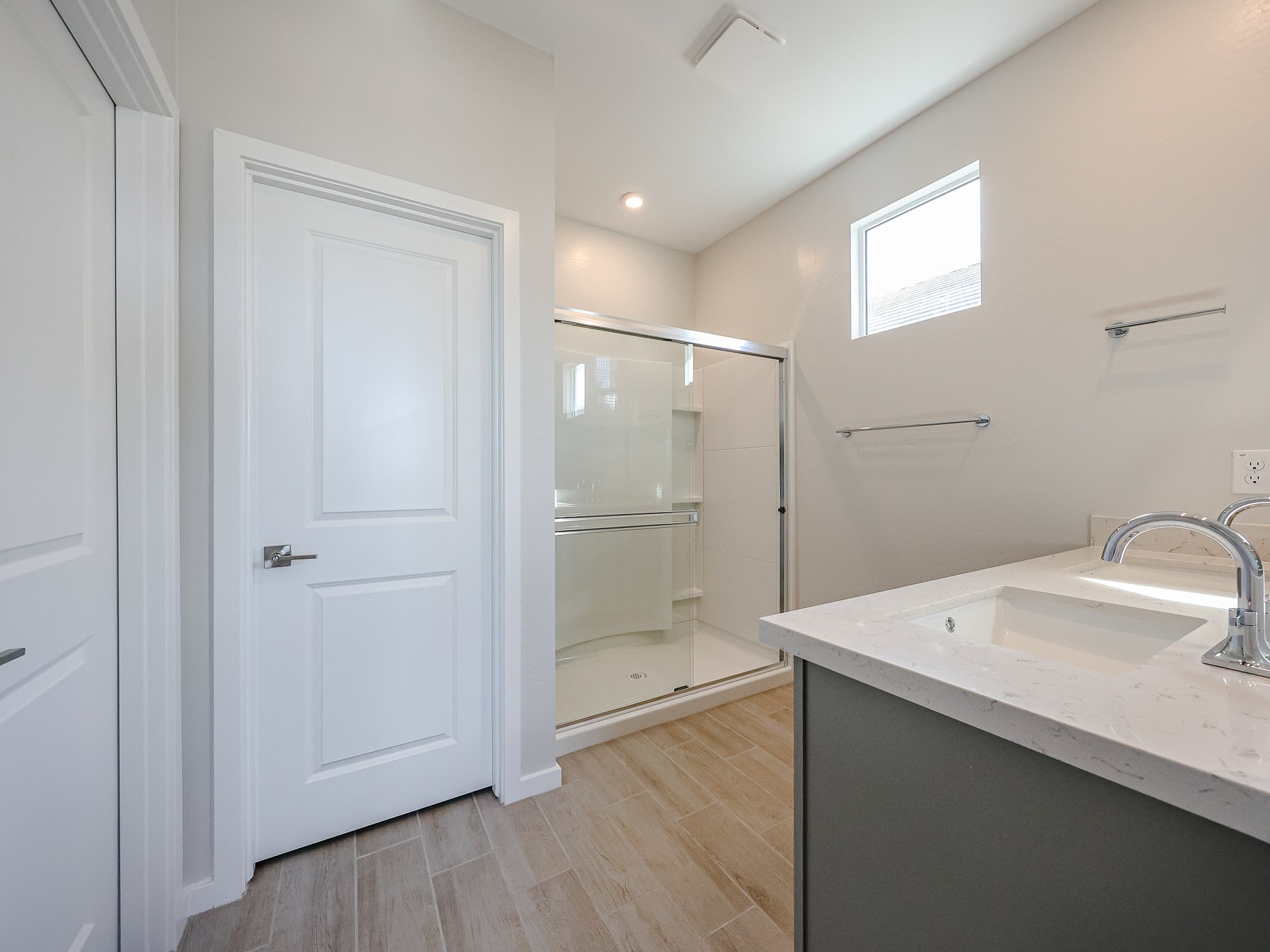 A bathroom with a glass shower.