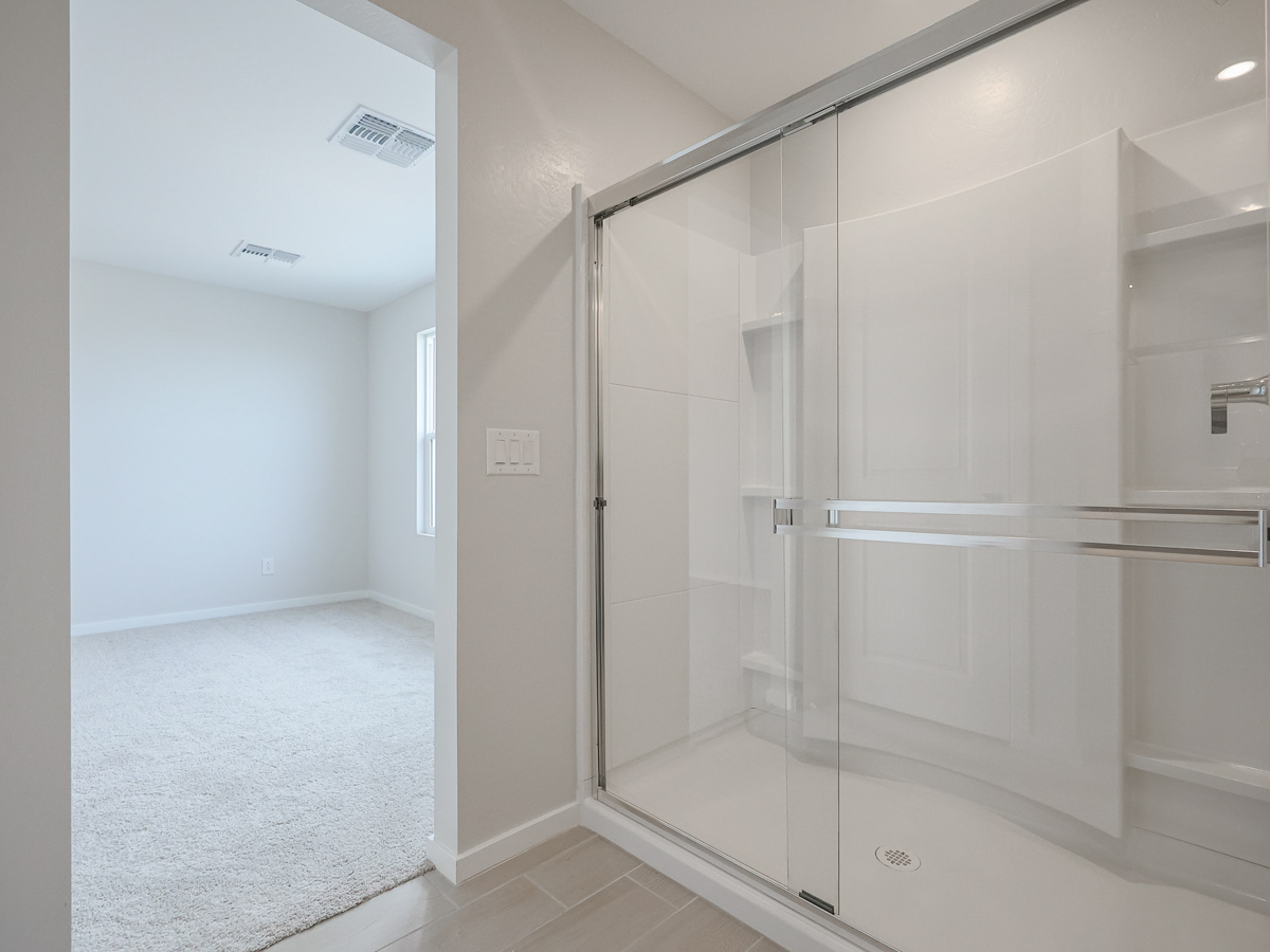 A shower unit in a bathroom.