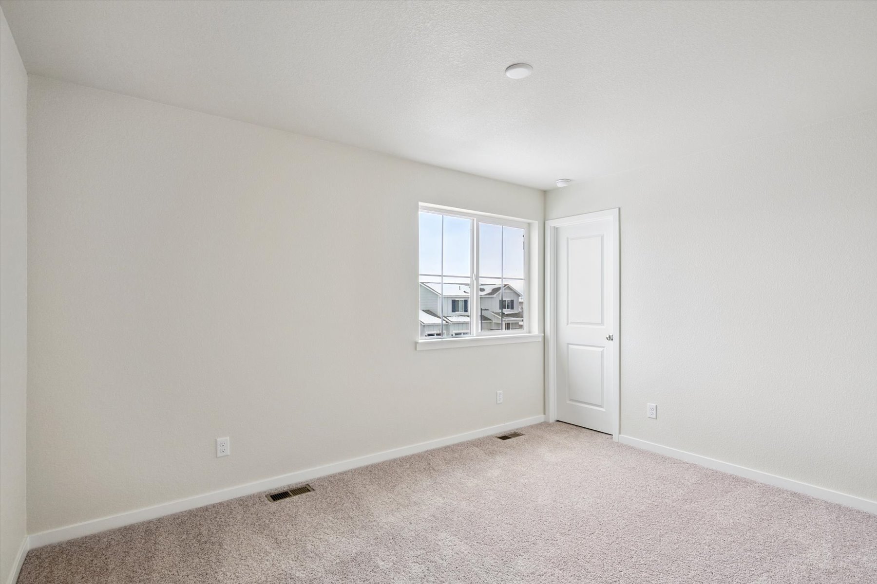 A room with a door and a window.