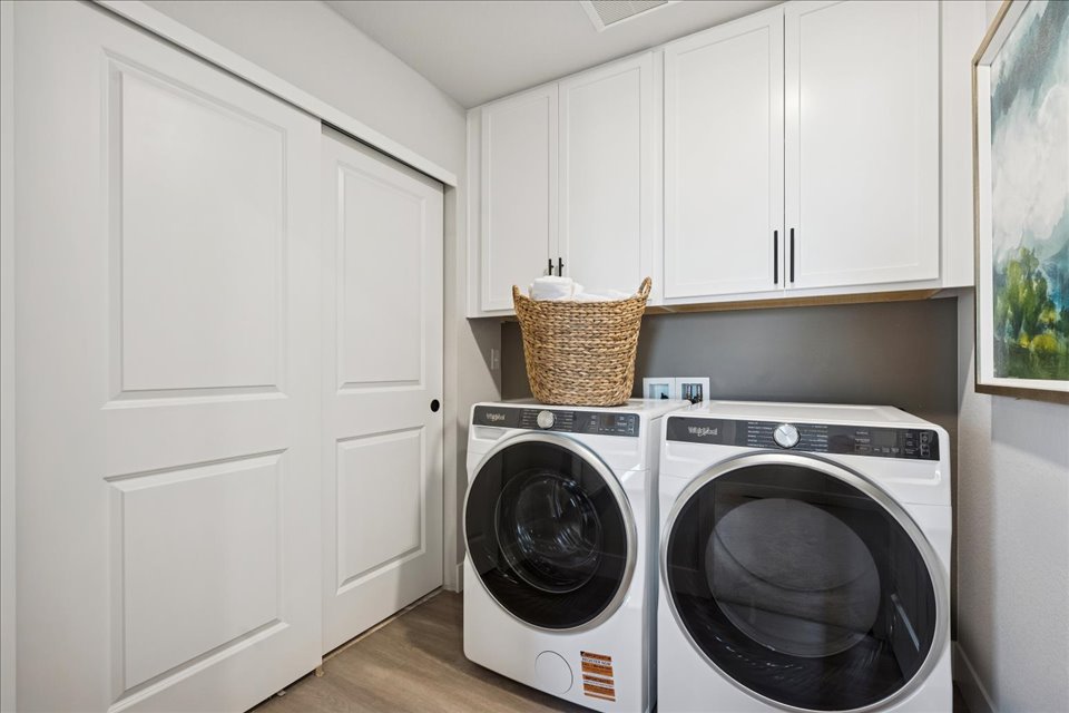 A white kitchen with white cabinets.