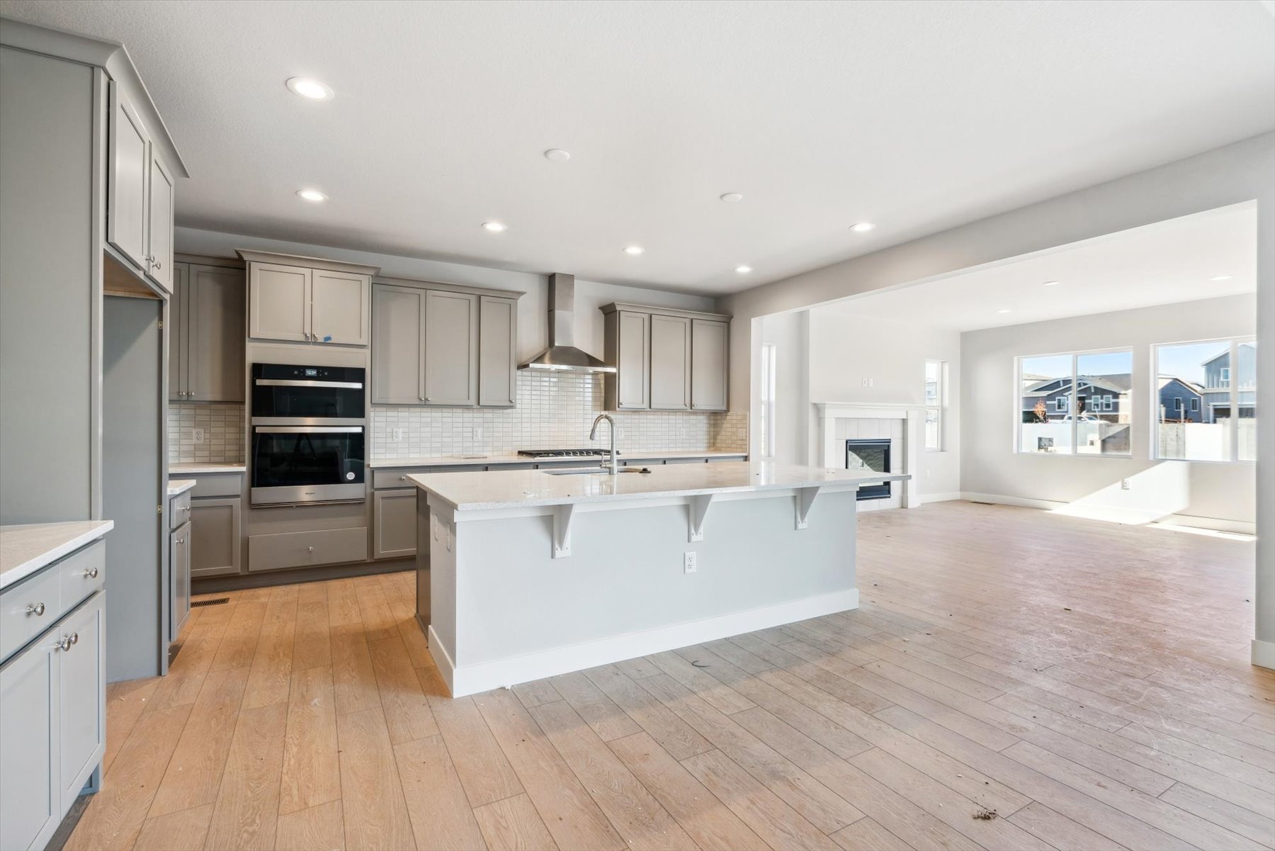A kitchen with white cabinets.