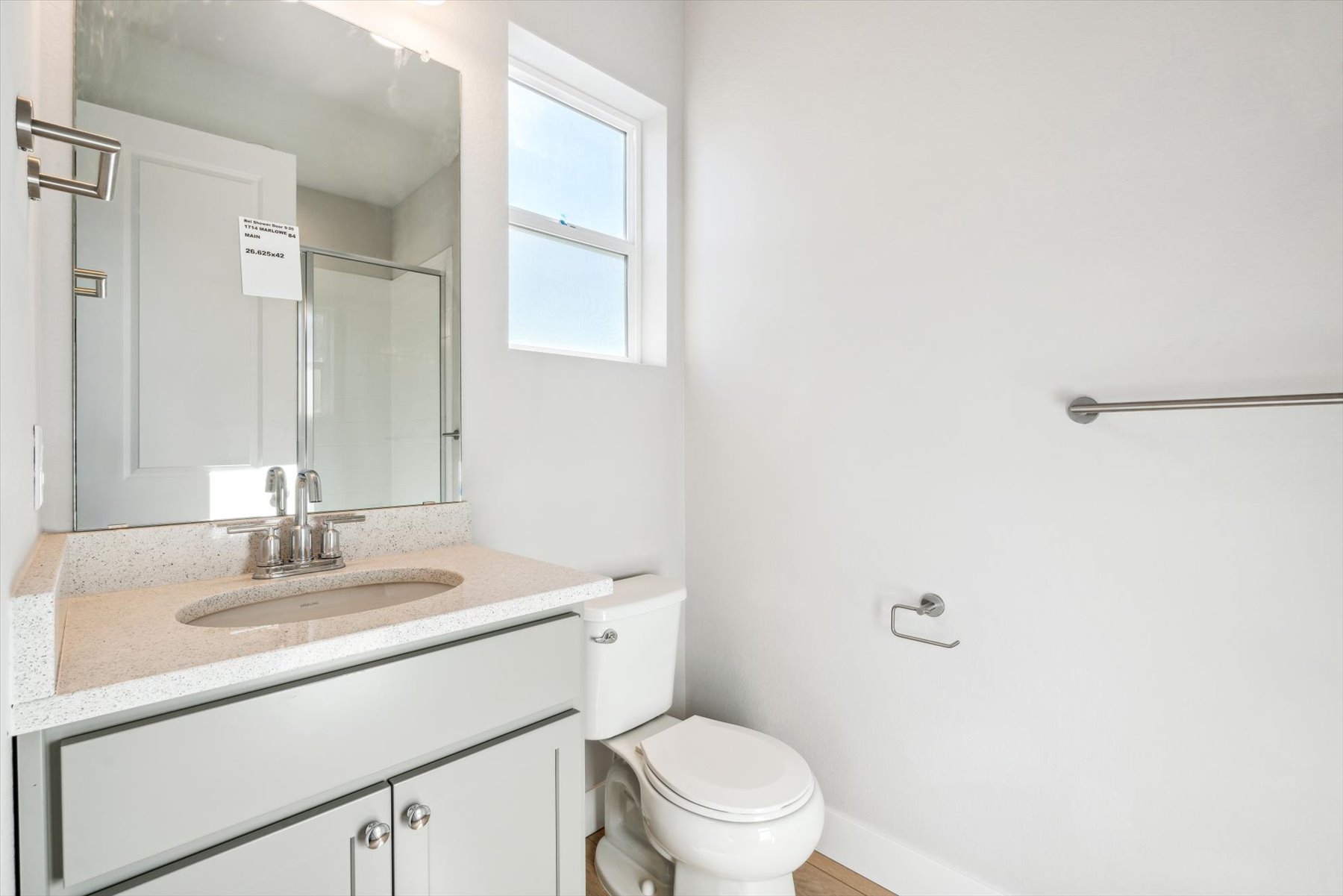 A bathroom with a sink and a toilet.