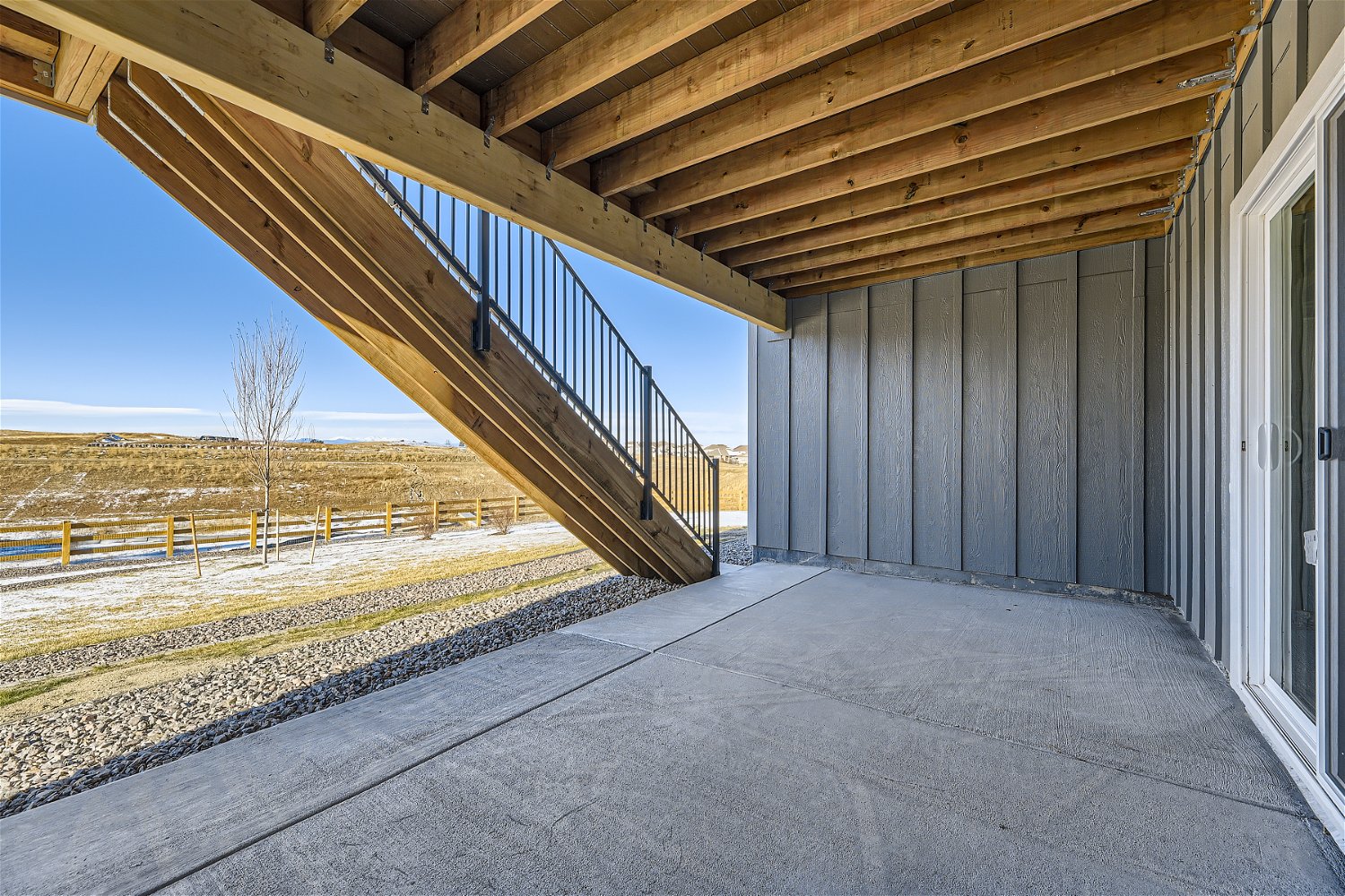A concrete walkway with a metal frame.