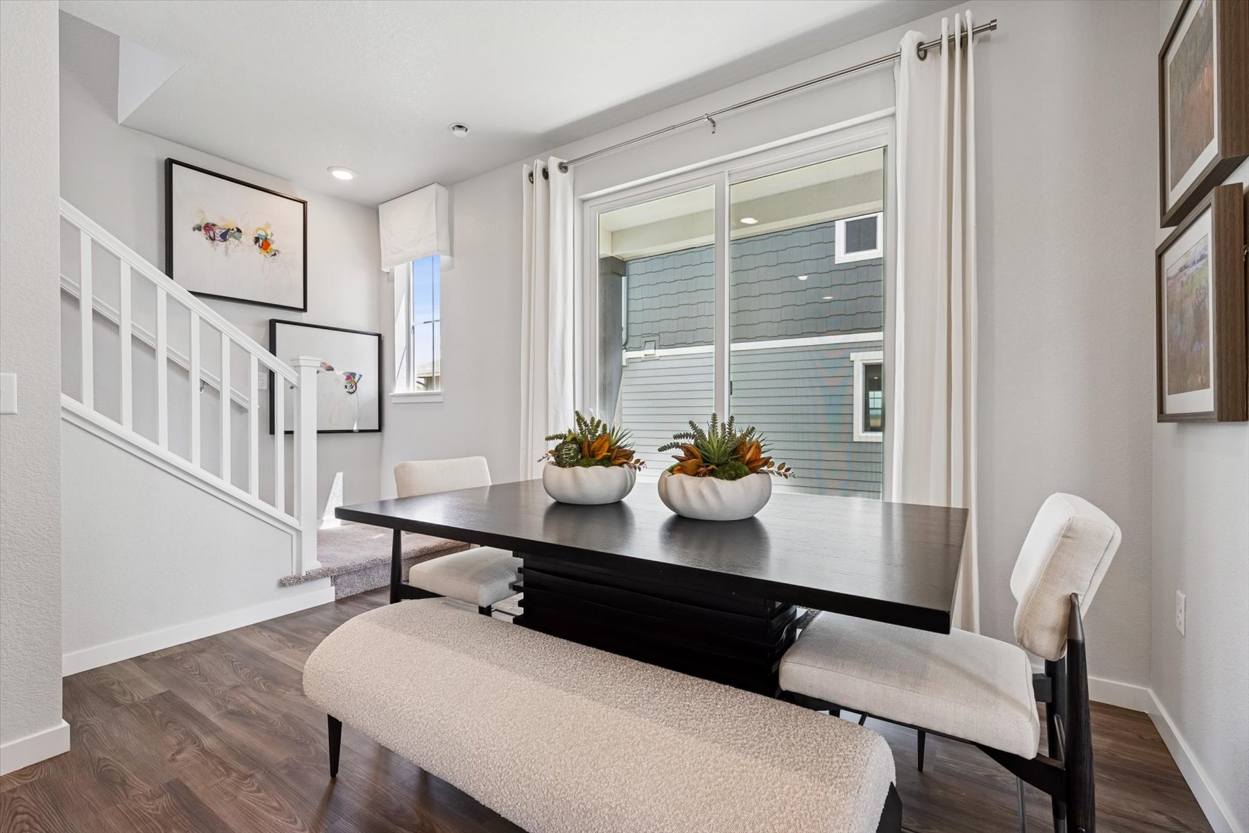 A room with a table and chairs.