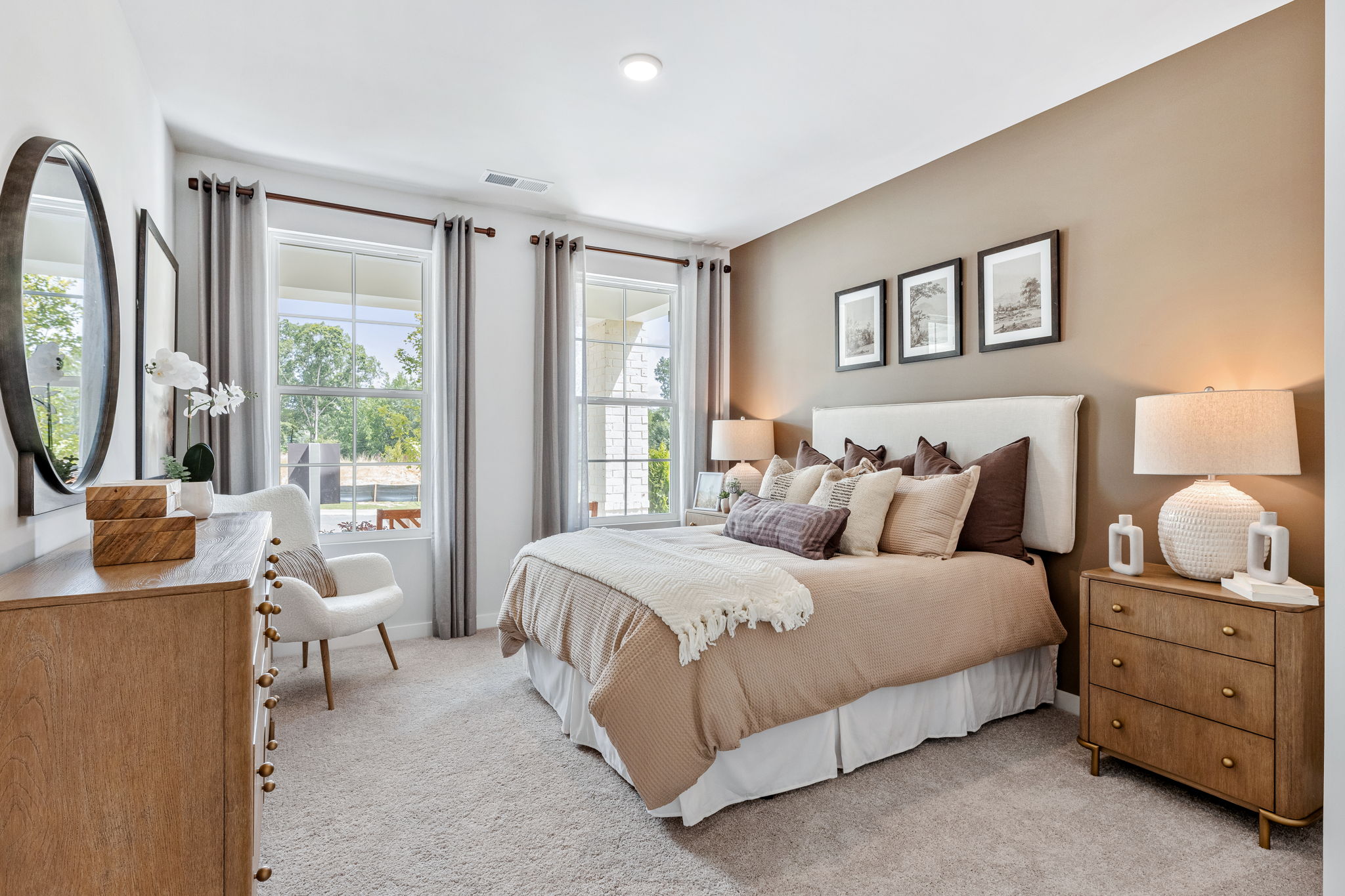 A bedroom with a large window.