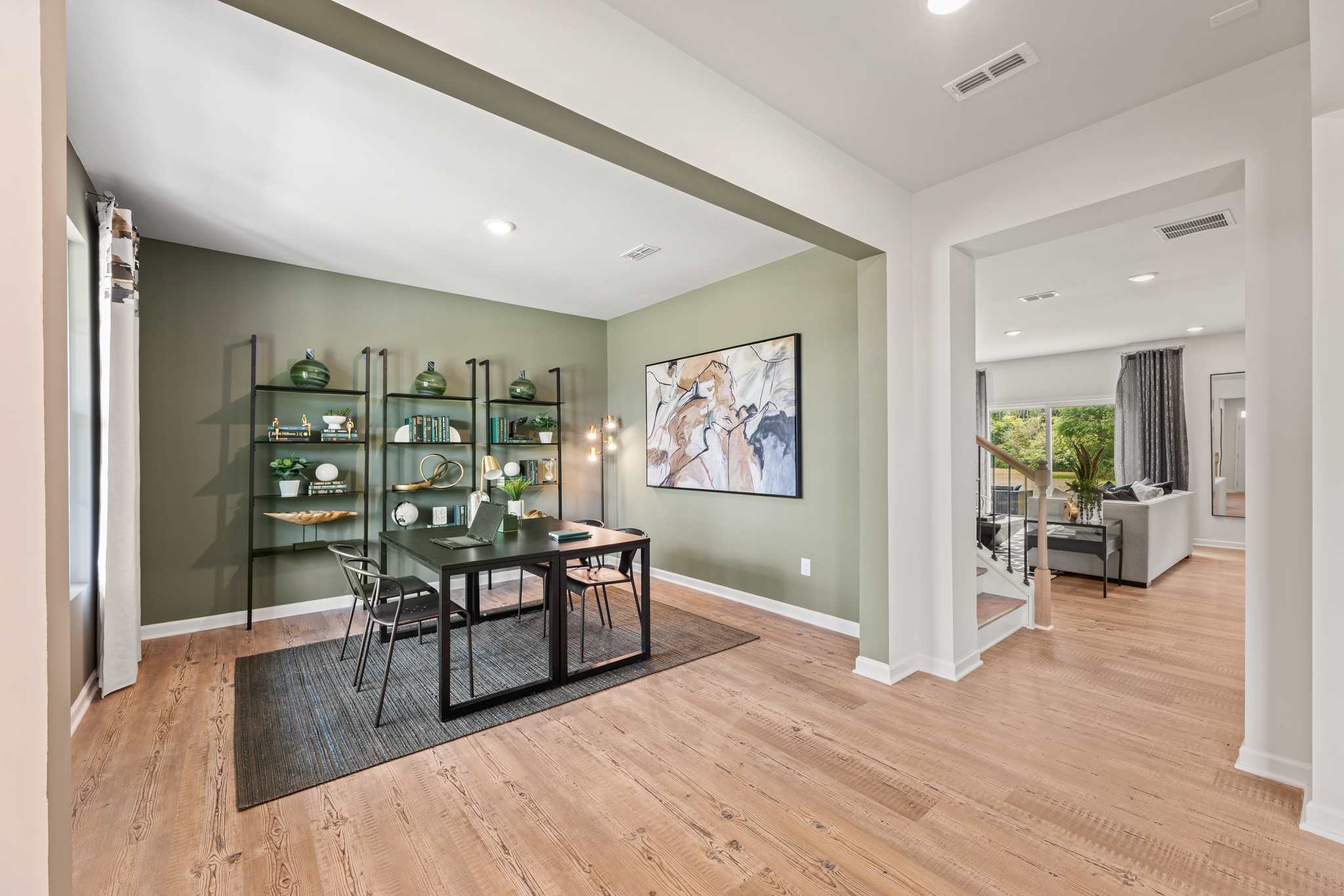 A room with a table and chairs.