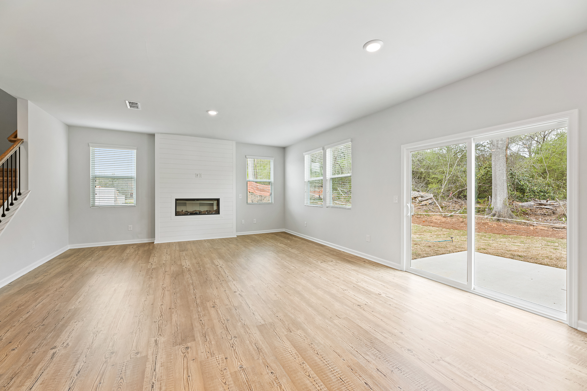A room with a wood floor and a wood floor.
