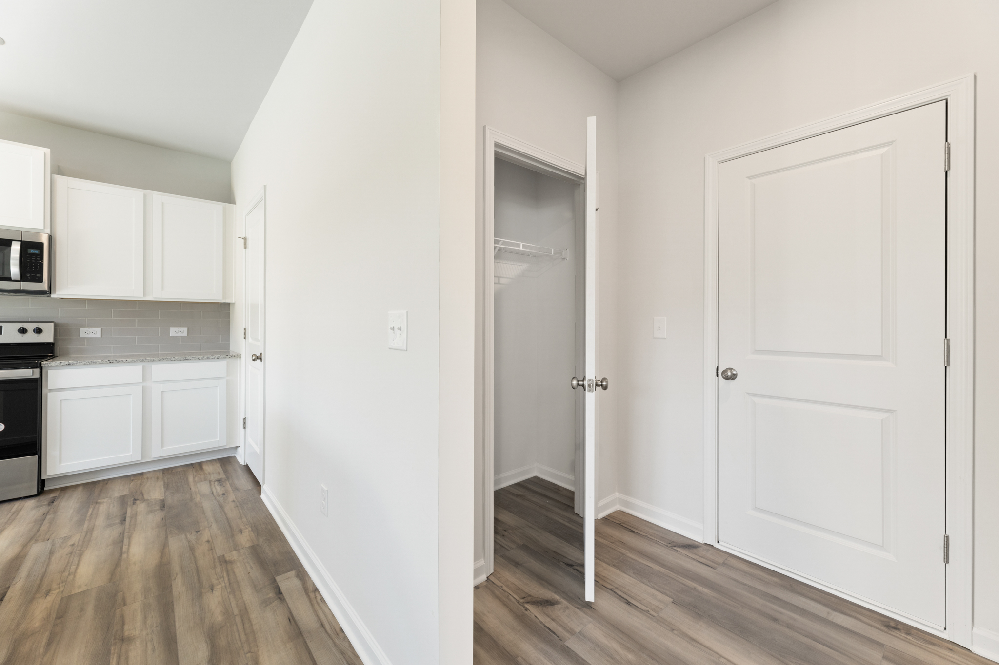 A room with white cabinets.