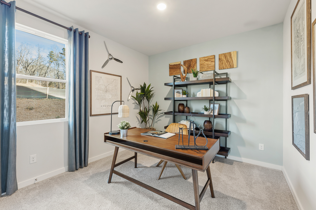 A room with a table and shelves.