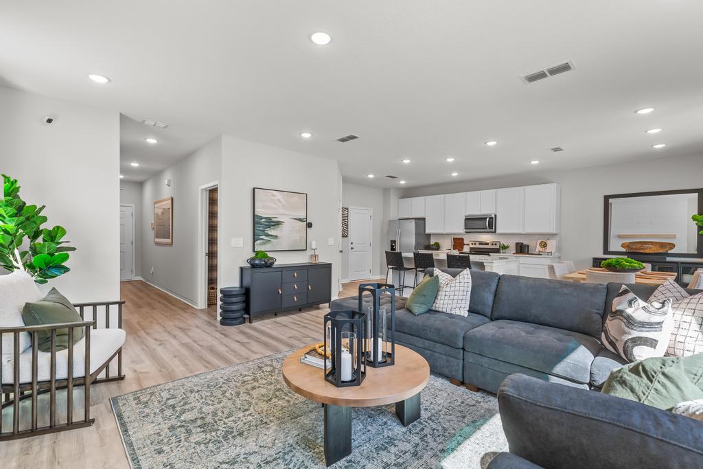 A living room with a couch and a table.