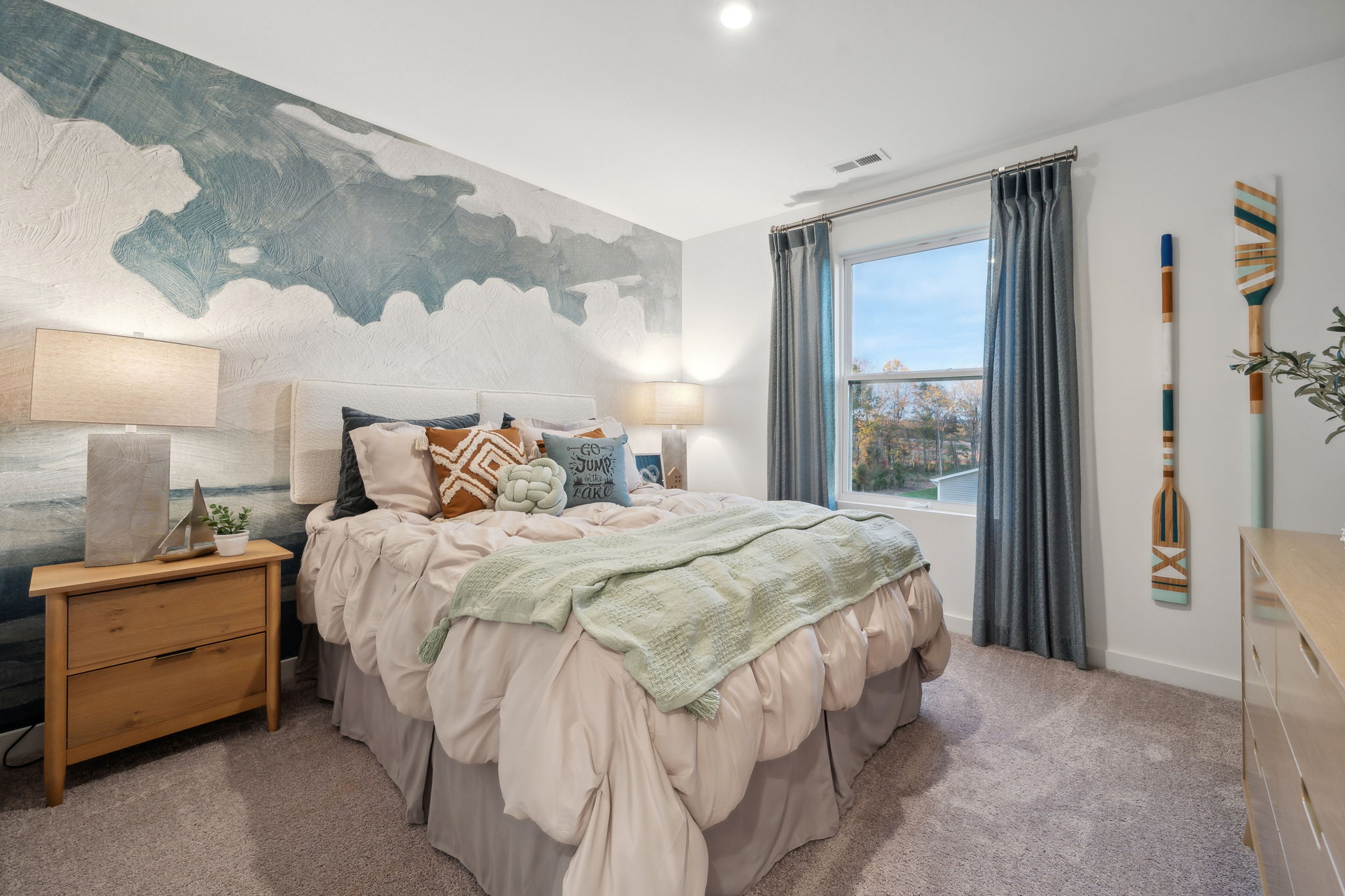 A bedroom with a large bed.