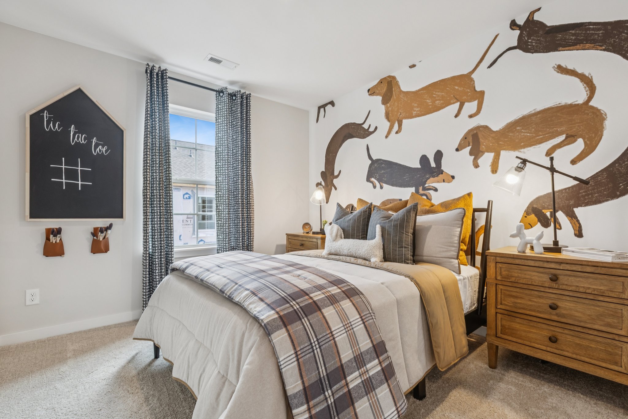A bedroom with a large bed and a large poster on the wall.