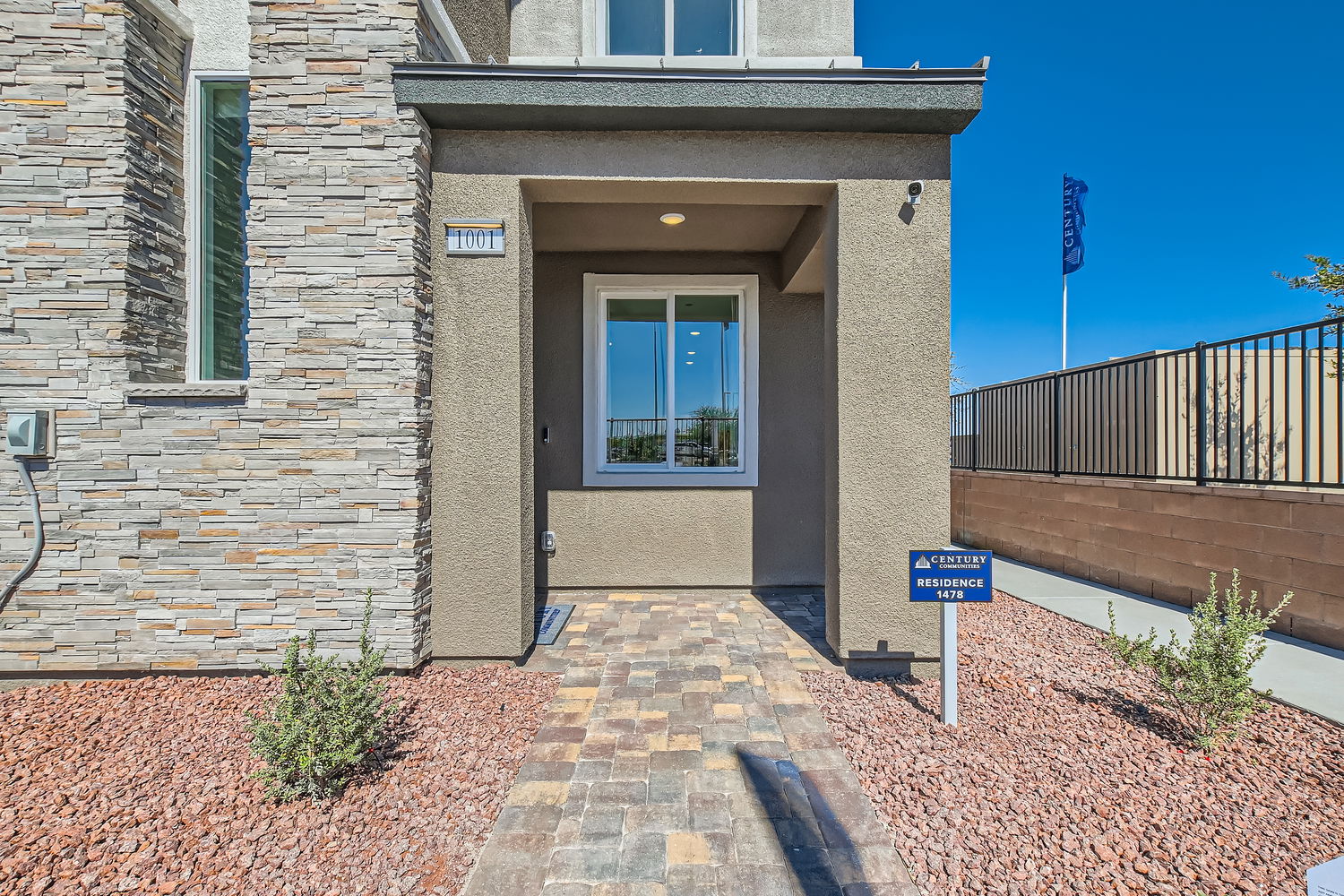A building with a sign in front.