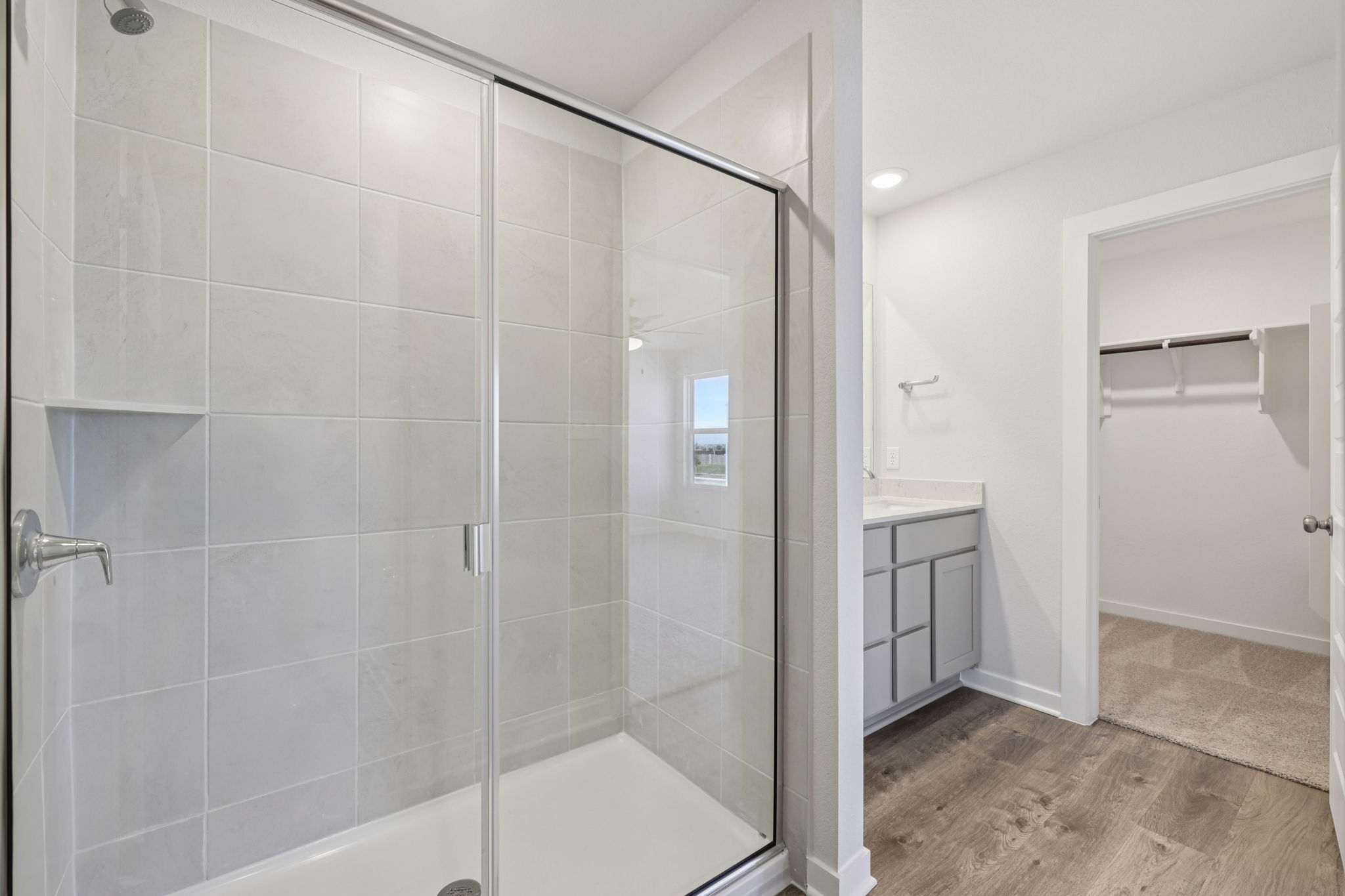 A bathroom with a glass shower.