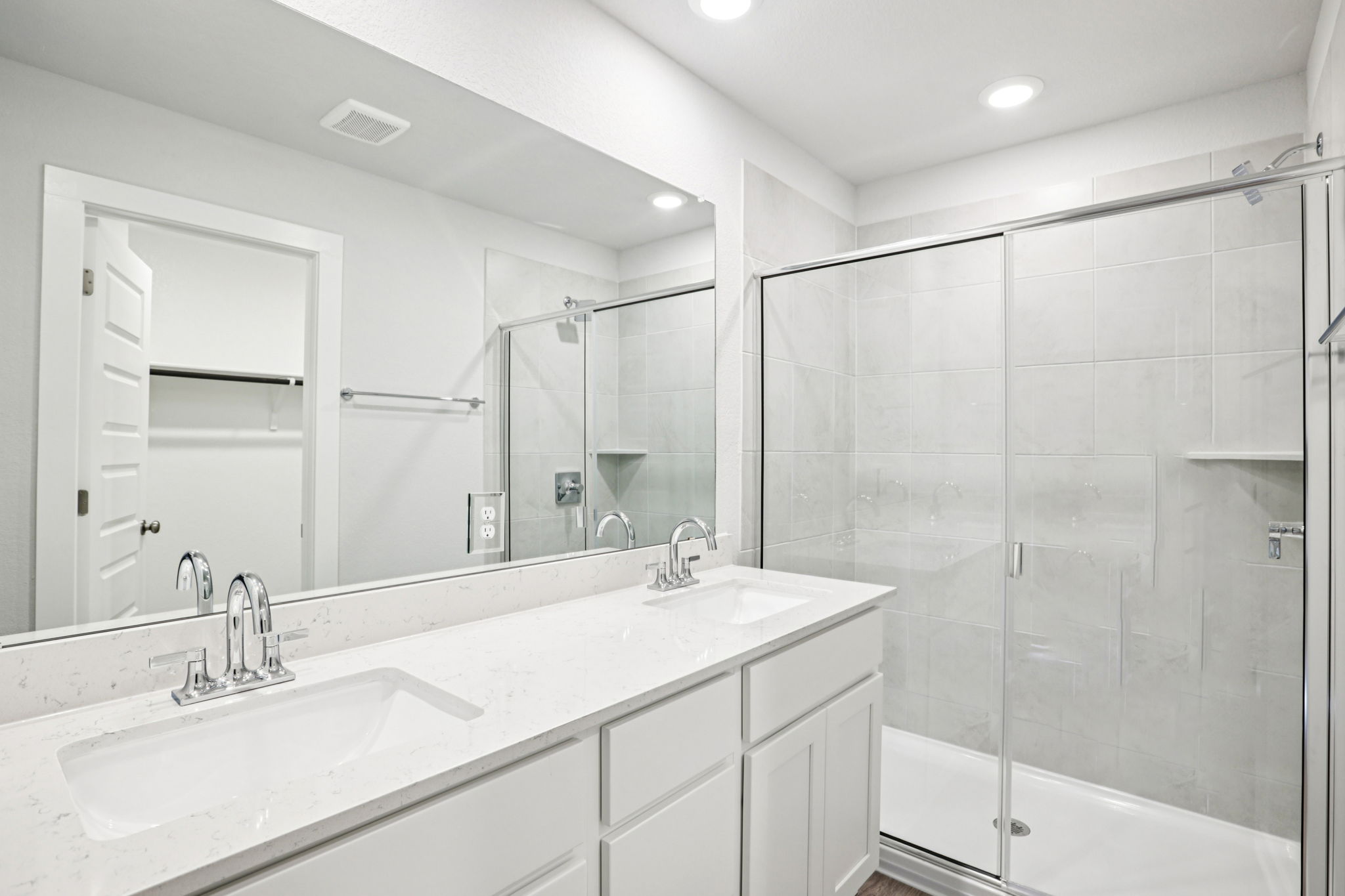 A bathroom with a glass shower.