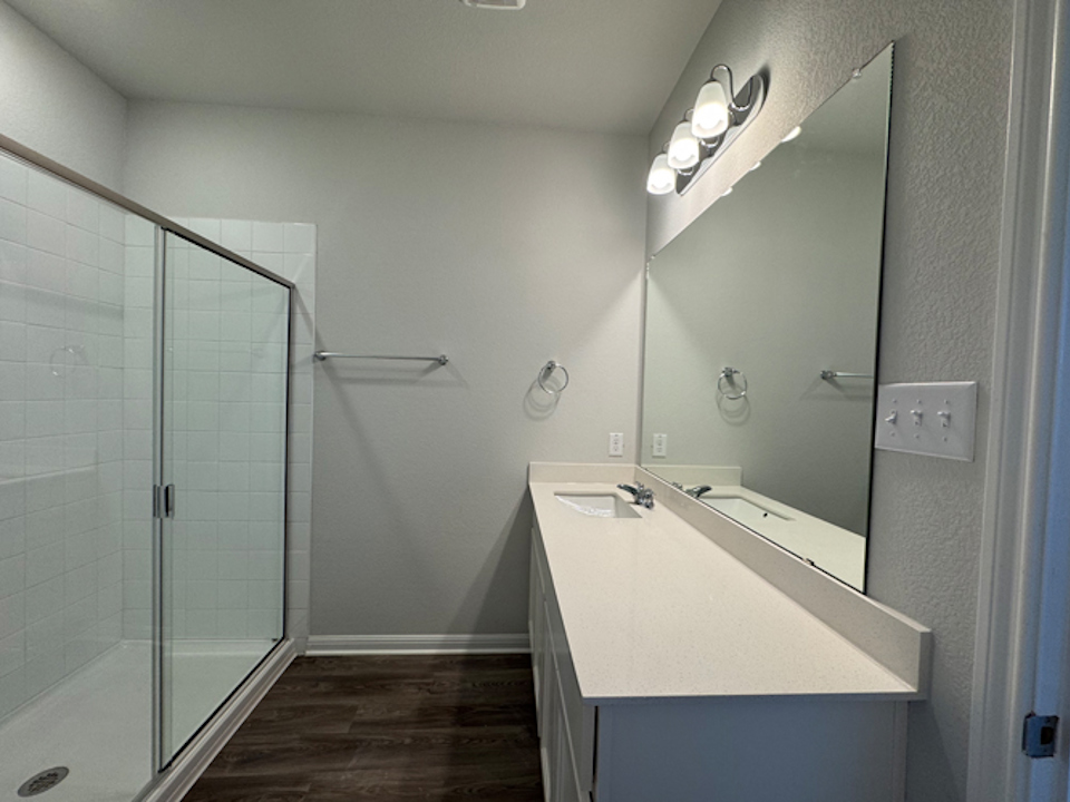 A bathroom with a glass shower.