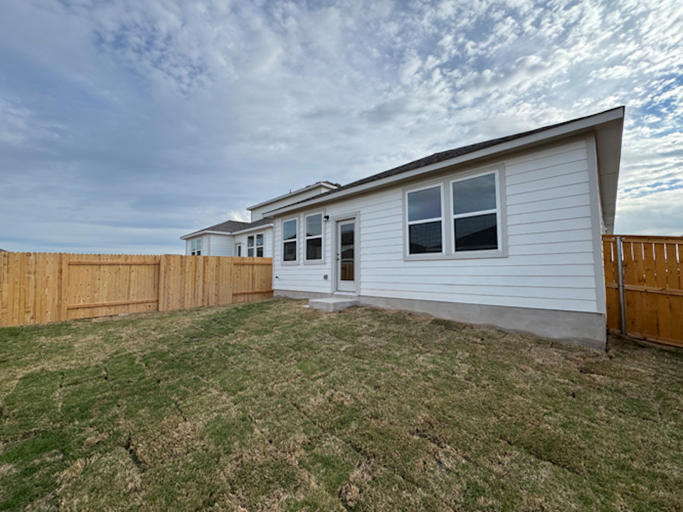 A house with a fence around it.