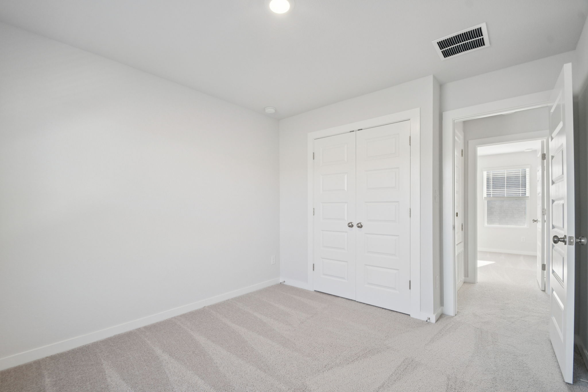 A room with white doors.