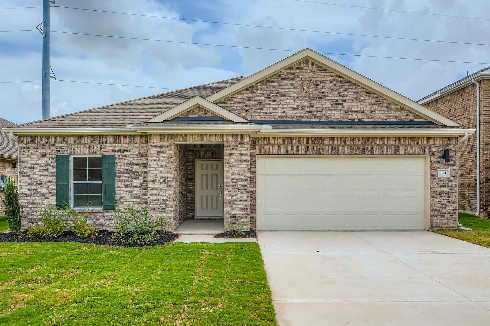 A brick building with a garage.