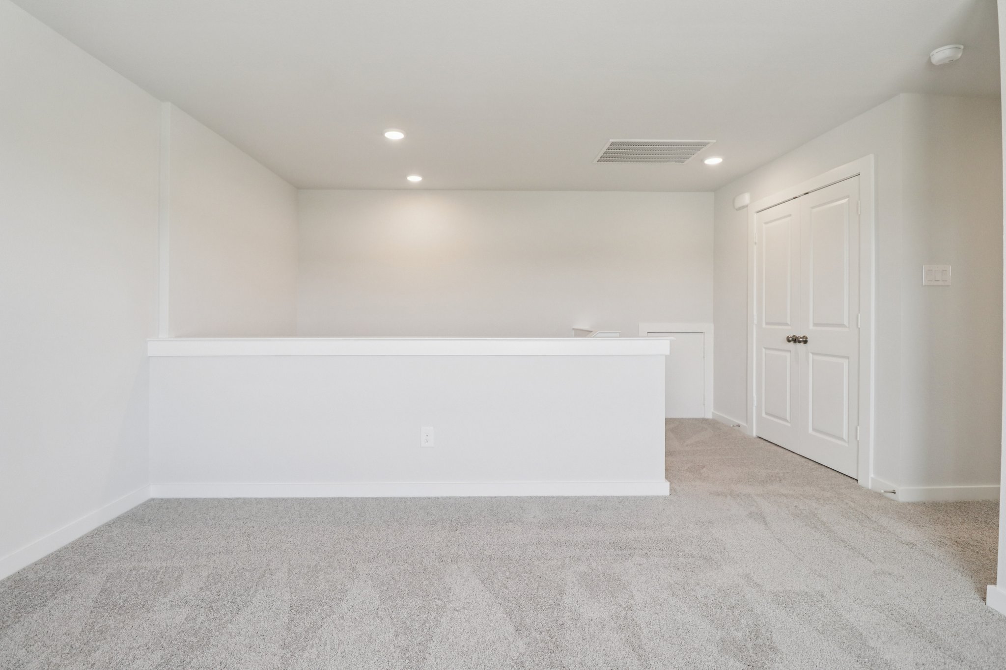 A room with white cabinets.