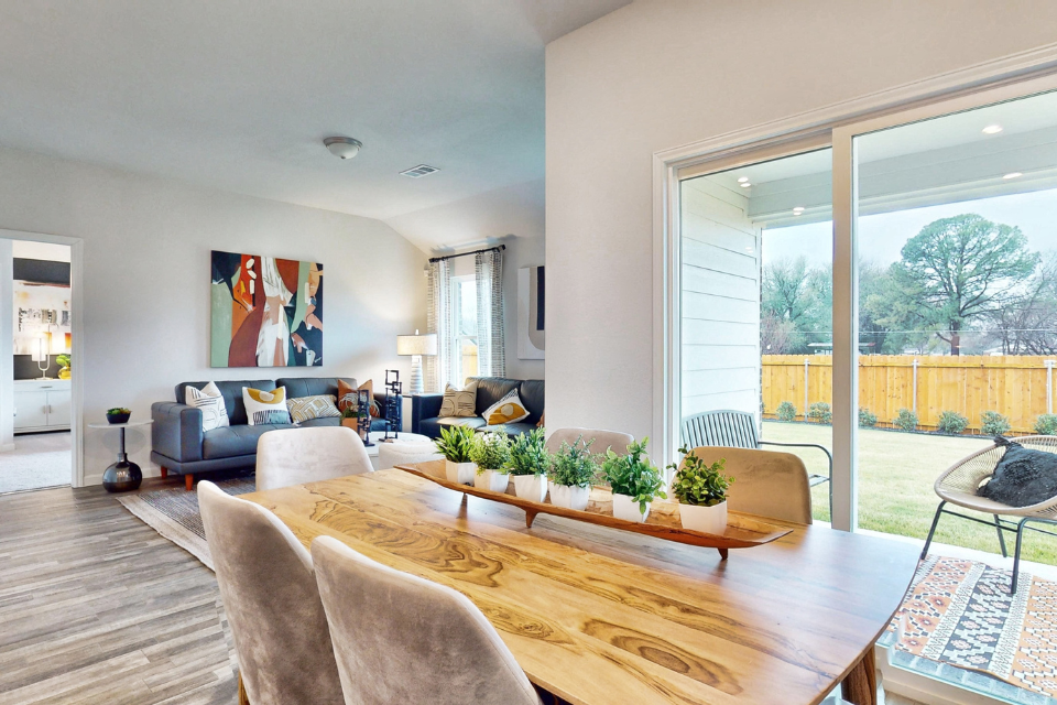 A living room with a large glass door.