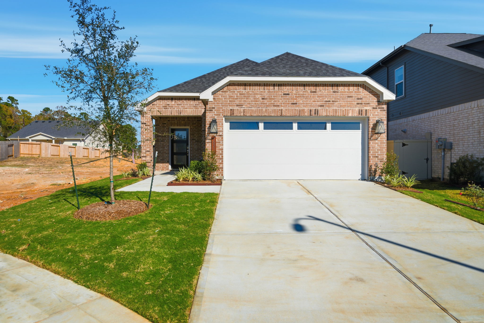 A driveway leading to a house.