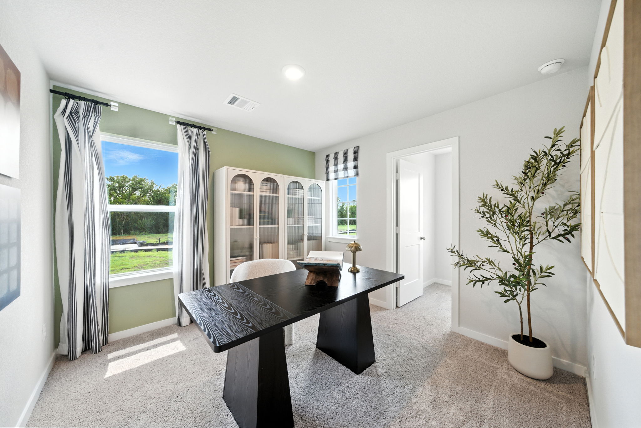 A room with a table and chairs.