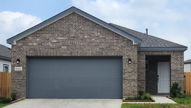 A brick building with garages.