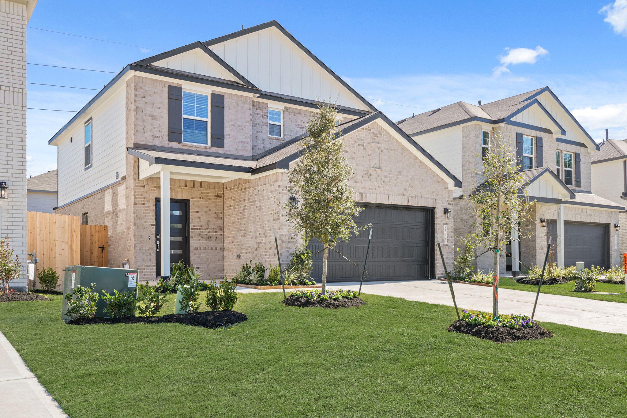 A house with a green lawn.